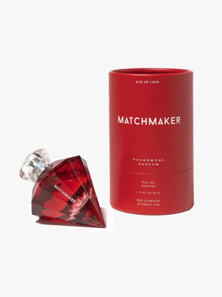Eye of Love Matchmaker Red Diamond Pheromone Parfum: red diamond-shaped perfume bottle alongside matching branded packaging box on a light gray background 